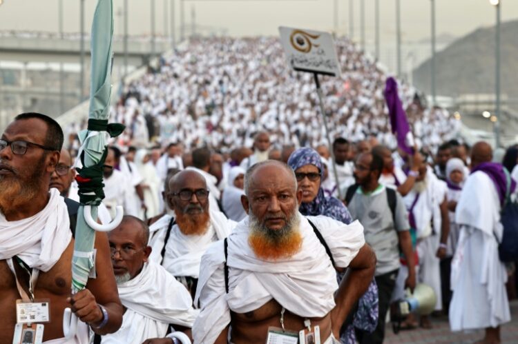 Pilgrims arrive to perform the symbolic