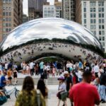 Visitors walk around Cloud Gate, also known as The Bean, at Millennium Park on June 23, 2024, in Chicago. The sculpture officially reopened Sunday morning. (Armando L. Sanchez/Chicago Tribune)