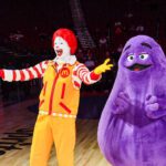 Grimace, a McDonalds' mascot, standing next to Ronald McDonald.