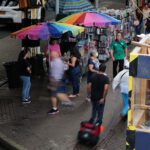 Street vendors selling fruit along Roosevelt Avenue in Queens on Aug. 16.