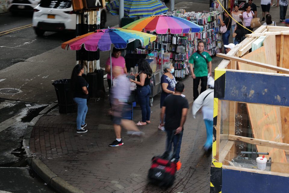 Street vendors selling fruit along Roosevelt Avenue in Queens on Aug. 16.