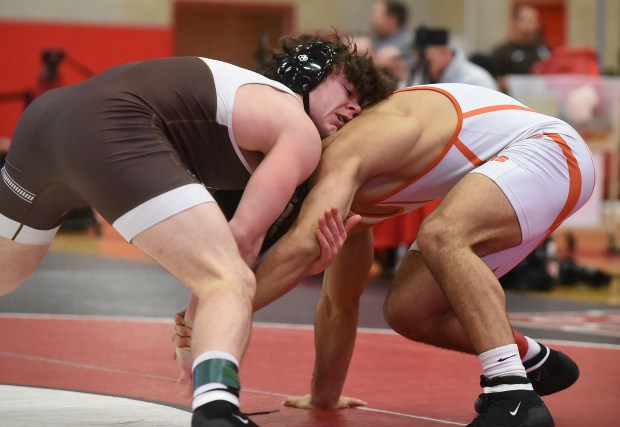 Mt. Carmel's Colin Kelly wrestles and defeats Wheaton Warrenville South's Sedeeq Al Obaidi 19-7 at 175 pounds during the Class 3A Hinsdale Central Sectional Saturday, February 10, 2024 in Hinsdale, IL. (Steve Johnston/Daily Southtown)