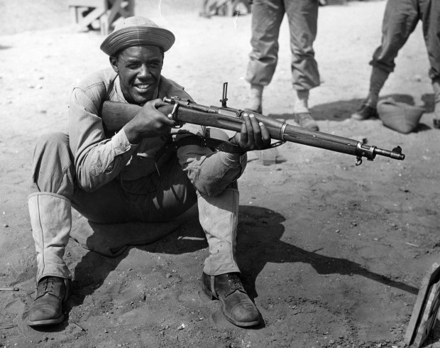 Private Fritz Pollard Jr., of Chicago, served in the military just like his father. Pollard Jr. served as a rifle range instructor for other Black soldiers in the Engineer Replacement Training Center at Fort Leonard Wood in Missouri, circa 1942. (Chicago Tribune archive)