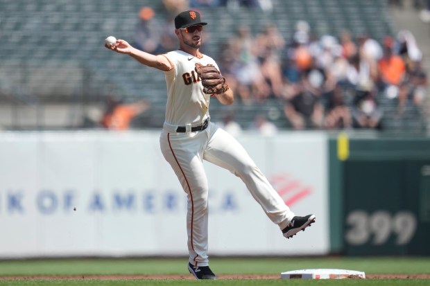 San Francisco Giants shortstop Paul DeJong throws out Cincinnati Reds' TJ Friedl at first base during the third inning of at a baseball game in San Francisco, Wednesday, Aug. 30, 2023. (AP Photo/Jeff Chiu)