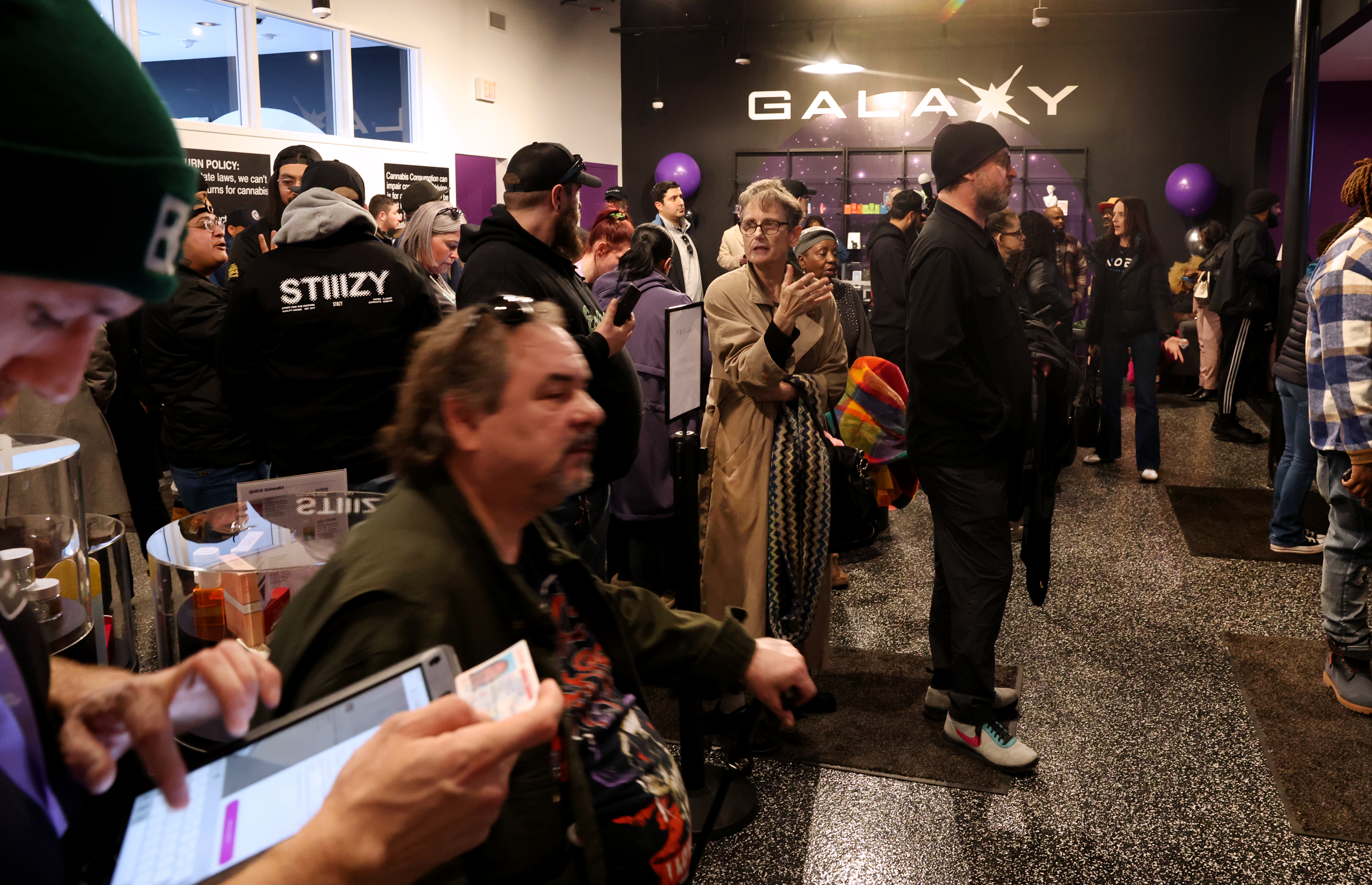 People wait in line at the grand opening of Galaxy...
