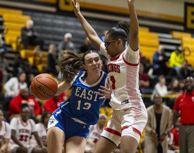 Homewood-Flossmoor's Aunyai Deere (3) tries to stop Lincoln-Way East's Maddie Yacobozzi (13) from driving to the lane during the Class 4A Joliet West Sectional final in Joliet on Thursday, Feb. 22, 2024. (Vincent D. Johnson / Daily Southtown)