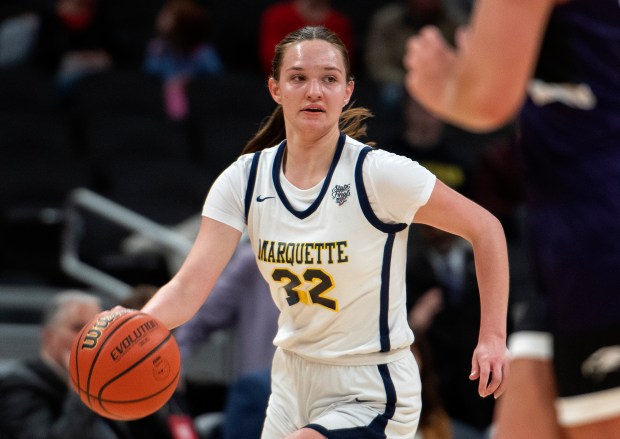 Marquette Catholic's Livia Balling moves the ball during the Class 1A state championship game against Lanesville at Gainbridge Fieldhouse in Indianapolis on Saturday, Feb. 24, 2024. (Michael Gard/for the Post-Tribune)
