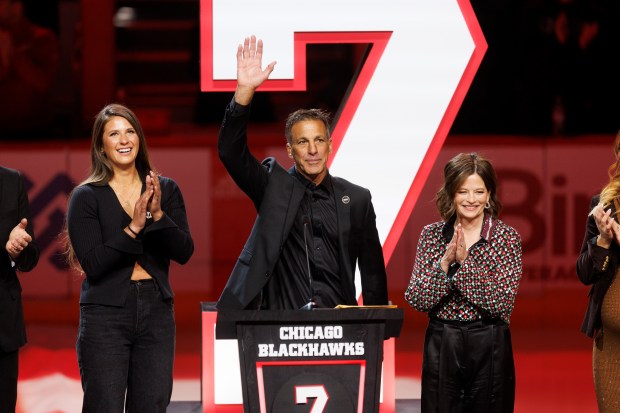 Chris Chelios and his family attend a ceremony to retire his No. 7 jersey before the Blackhawks play the Detroit Red Wings at the United Center Sunday Feb. 25, 2024 in Chicago. The Chicago native played for the Blackhawks for nine of his 26 NHL seasons. (Armando L. Sanchez/Chicago Tribune)