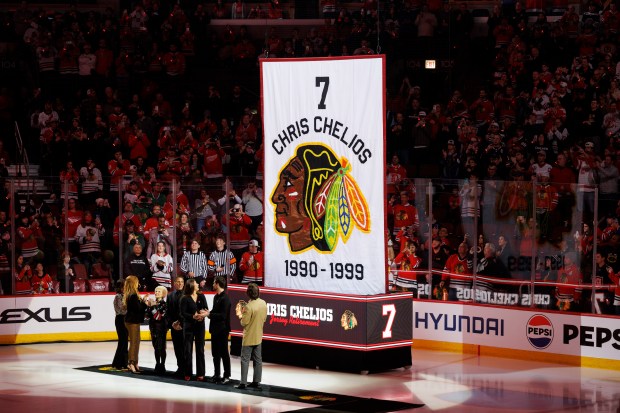 Chris Chelios and his family attend a ceremony to retire his No. 7 jersey before the Blackhawks play the Detroit Red Wings at the United Center Sunday Feb. 25, 2024 in Chicago. The Chicago native played for the Blackhawks for nine of his 26 NHL seasons. (Armando L. Sanchez/Chicago Tribune)