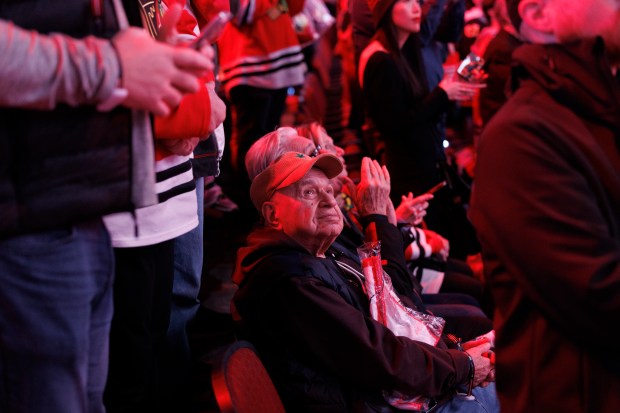 People watch as Chris Chelios's No. 7 jersey is retired before the Blackhawks play the Detroit Red Wings at the United Center Sunday Feb. 25, 2024 in Chicago. The Chicago native played for the Blackhawks for nine of his 26 NHL seasons. (Armando L. Sanchez/Chicago Tribune)