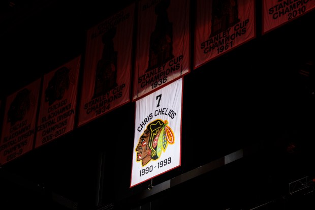 Chris Chelios's No. 7 jersey is lifted above the ice during a retirement ceremony before the Blackhawks play the Detroit Red Wings at the United Center Sunday Feb. 25, 2024 in Chicago. The Chicago native played for the Blackhawks for nine of his 26 NHL seasons. (Armando L. Sanchez/Chicago Tribune)