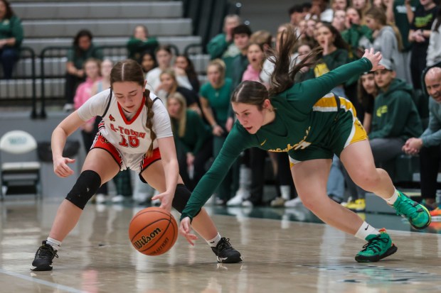 Waubonsie Valley's Maya Cobb (3) steals the ball from Alton's Allison Pruitt (15) during the Class 4A Illinois Wesleyan Supersectional in Bloomington on Monday, Feb. 26 2024. (Troy Stolt for the Aurora Beacon News)