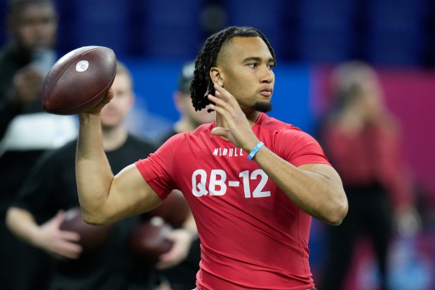 Ohio State quarterback CJ Stroud runs a drill at the NFL football scouting combine in Indianapolis, Saturday, March 4, 2023. (AP Photo/Michael Conroy)