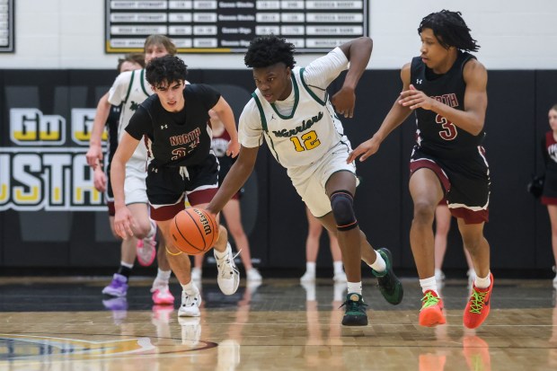 Waubonsie Valley's Tyreek Coleman (12) dribbles down court on a fast break during the Class 4A Metea Valley Regional final against Plainfield North on Thursday, Feb. 22 2024. (Troy Stolt for the Aurora News Beacon)