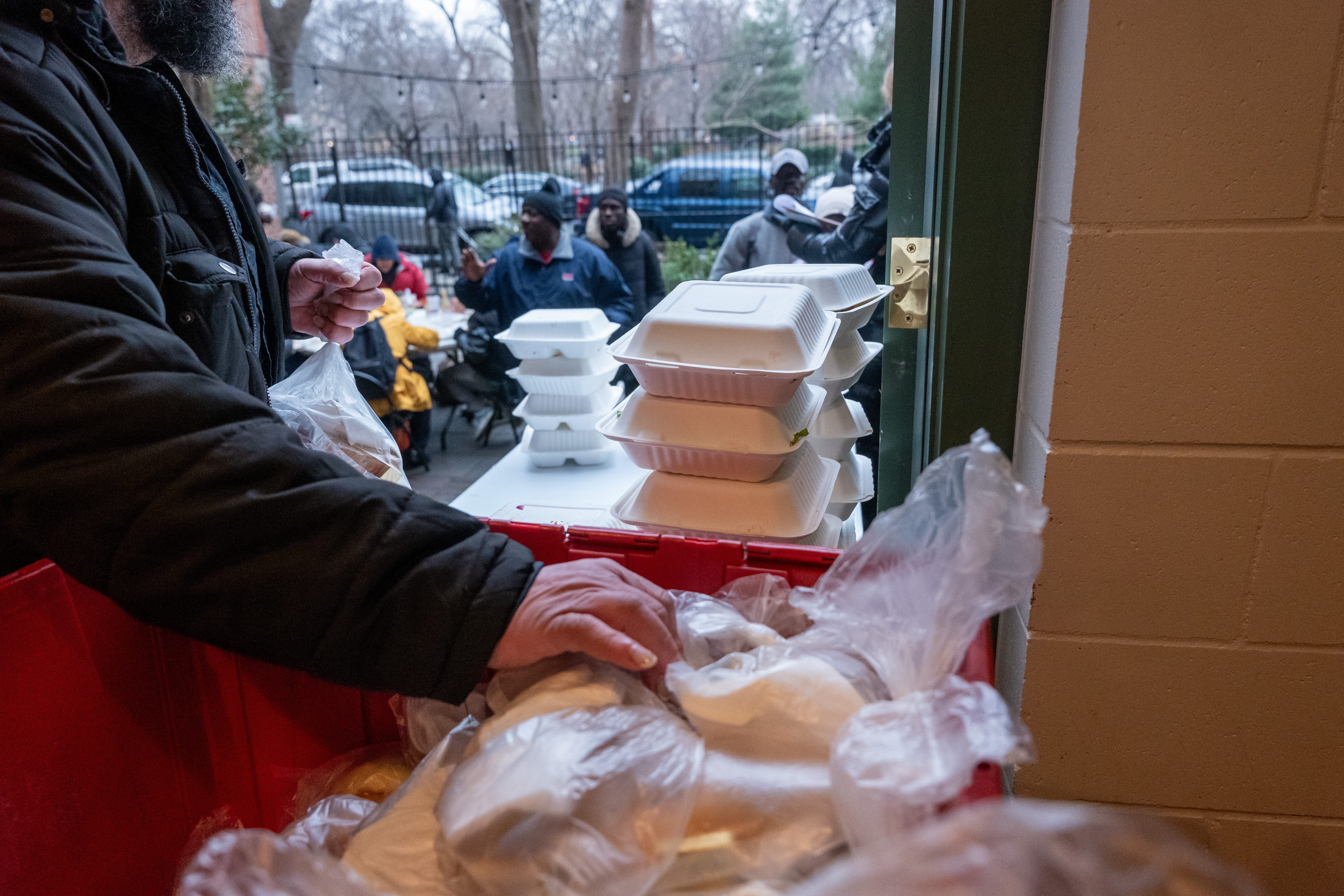 A photo of church volunteers handing out food