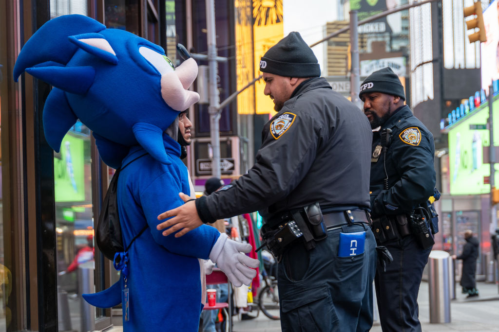 two bearded cops arresting a sonic the hedgehog character