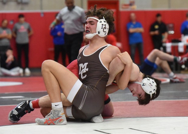 Batavia's Aidan Huck wrestles and defeats Mt. Carmel's Jairo Acuna 5-3 at 144 pounds during the Class 3A Hinsdale Central Sectional Saturday, February 10, 2024 in Hinsdale, IL. (Steve Johnston/Daily Southtown)