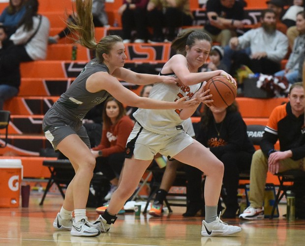 Evergreen Park'S Taylor Yeaman (3) and Shepard'S Emma Greene (33) battle during a South Suburban Conference game Thursday, February 8, 2024 in Palos Heights, IL. (Steve Johnston/Daily Southtown)