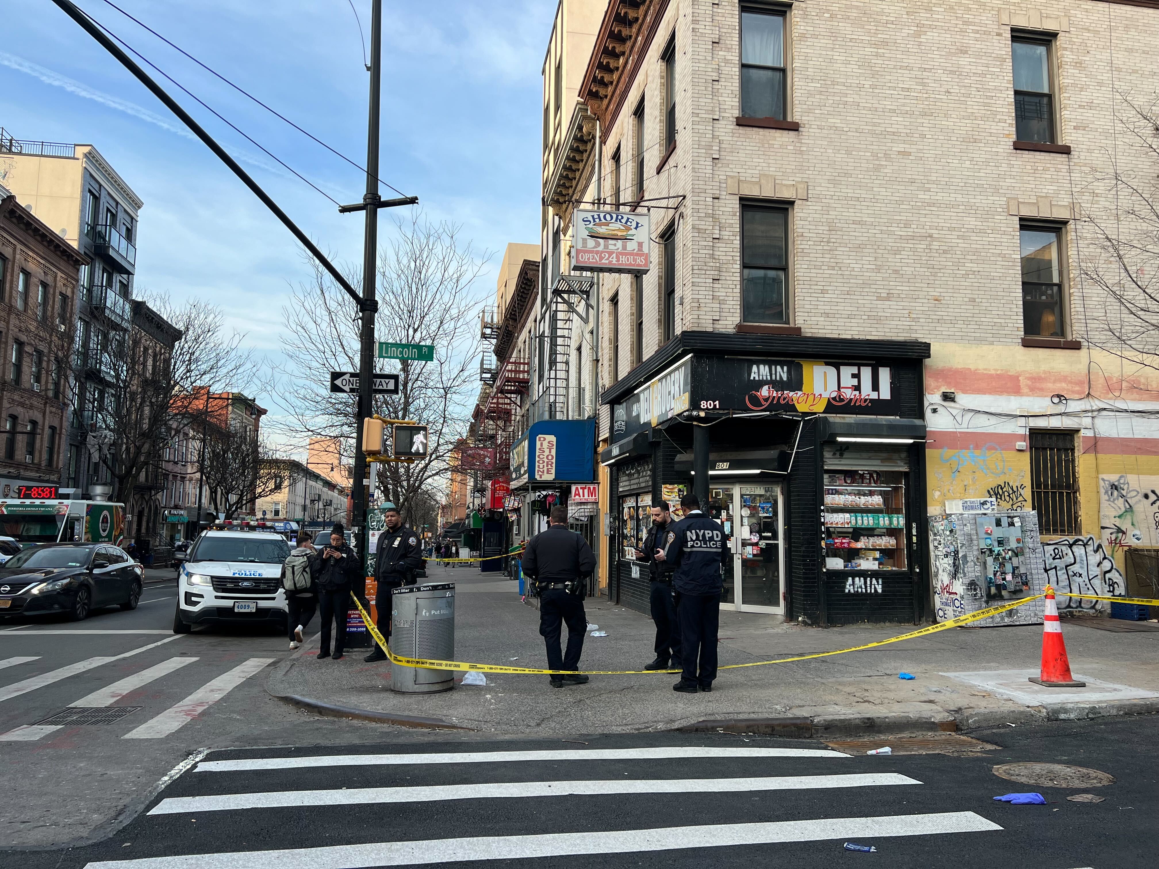 Police respond to the scene of a shooting in Brooklyn on Monday evening.