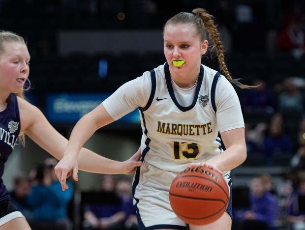 Marquette Catholic's Marissa Pleasant moves the ball during the Class 1A state championship game against Lanesville at Gainbridge Fieldhouse in Indianapolis on Saturday, Feb. 24, 2024. (Michael Gard/for the Post-Tribune)