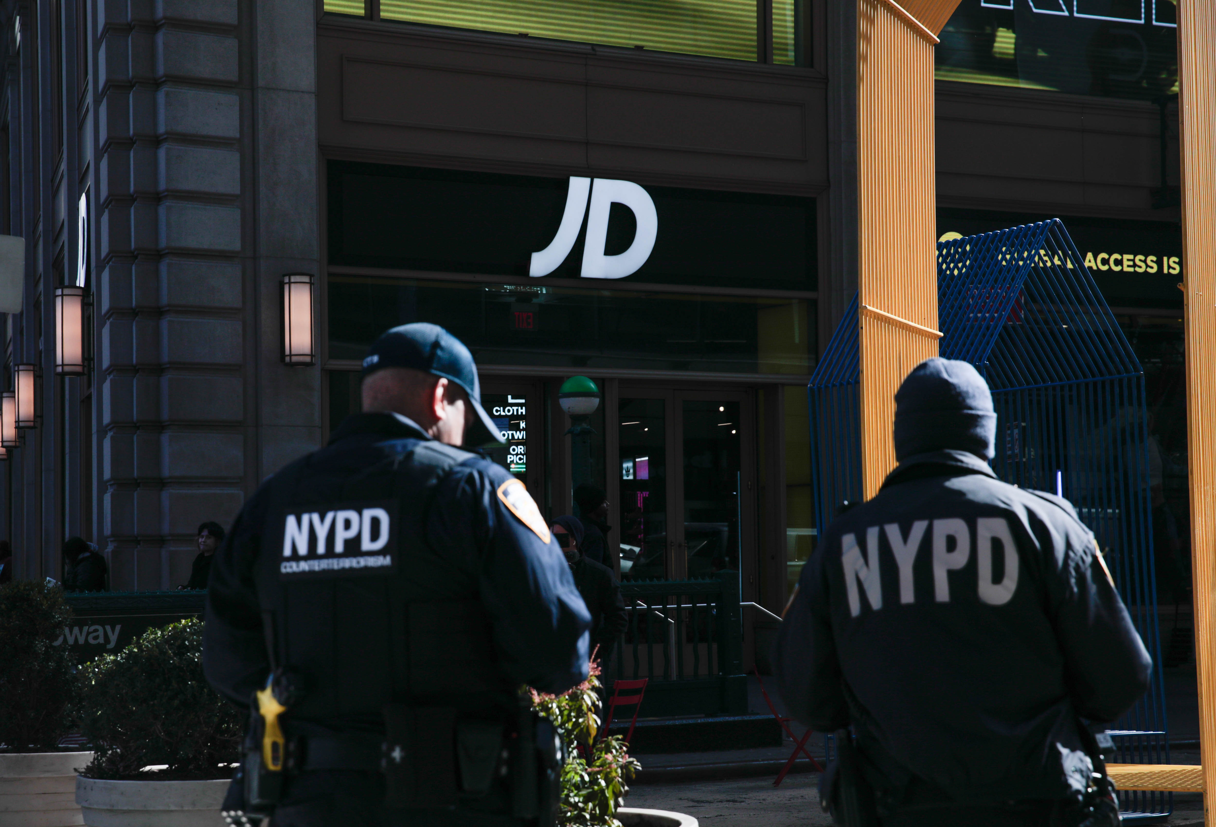 A photo of police outside the Times Square sporting goods store where a teen allegedly shot a bystander and fired at police.