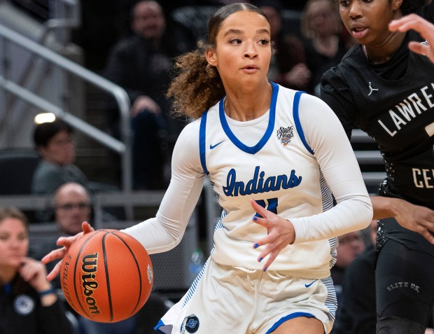 Lake Central's Nadia Clayton moves the ball during the Class 4A state championship game against Lawrence Central at Gainbridge Fieldhouse in Indianapolis on Saturday, Feb. 24, 2024. (Michael Gard/for the Post-Tribune)