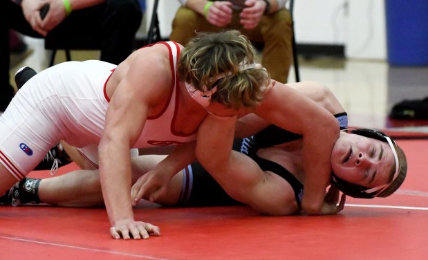 Crown Point's Will Clark, left, battles Hanover Central's Jayden Bartoszek during the 215 pound final of the IHSAA East Chicago Central Semistate in East Chicago, Indiana Saturday February 10, 2024. (Andy Lavalley for the Post-Tribune)