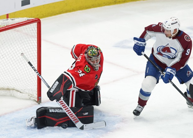 Blackhawks goaltender Petr Mrazek (34) deflects a shot on goal moments before Avalanche center Ross Colton, not pictured, scores in the second period on Feb. 29, 2024, at the United Center. (John J. Kim/Chicago Tribune)