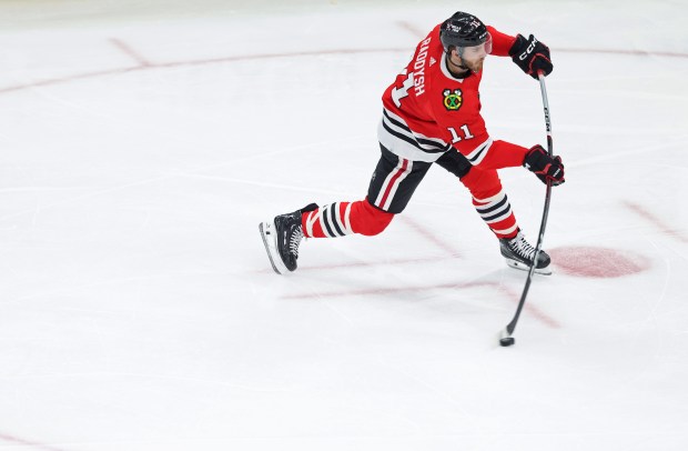 Blackhawks right wing Taylor Raddysh (11) takes a shot on goal in the second period against the Avalanche on Feb. 29, 2024, at the United Center. (John J. Kim/Chicago Tribune)