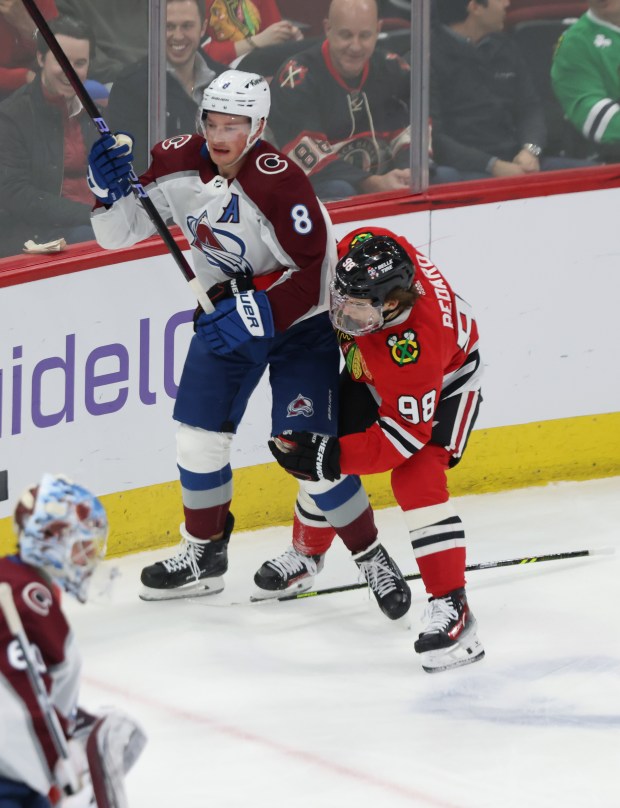 Blackhawks center Connor Bedard (98) loses his stick while making contact with Avalanche defenseman Cale Makar in the first period on Feb. 29, 2024, at the United Center. (John J. Kim/Chicago Tribune)