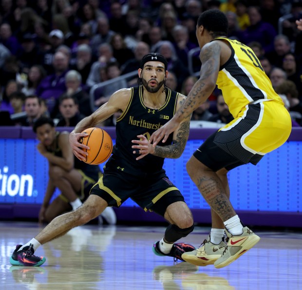 Northwestern guard Boo Buie (0) makes a move in the first half of a game against Iowa at Welsh-Ryan Arena in Evanston on March 2, 2024. (Chris Sweda/Chicago Tribune)