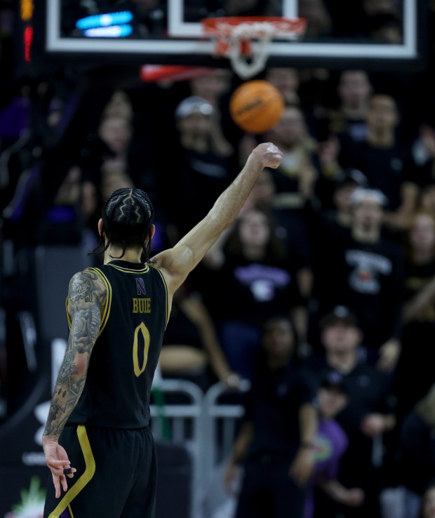 Northwestern guard Boo Buie (0) follows through on a 3-pointer in the second half against Iowa at Welsh-Ryan Arena in Evanston on March 2, 2024. (Chris Sweda/Chicago Tribune)