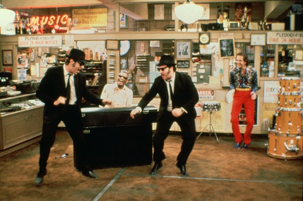 Dan Akroyd, and John Belushi during the making of "The Blues Brothers" movie along with Ray Charles, at piano, and Murphy Dunne. (Universal Studios)