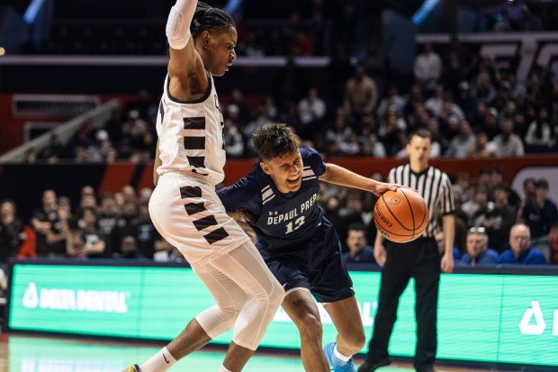 DePaul Prep's Makai Kvamme (13) draws a foul on Mount Carmel's Lee Marks (11) during the Class 3A state championship game at State Farm Center in Champaign on Saturday, March 9, 2024. (Vincent D. Johnson/for the Daily Southtown)