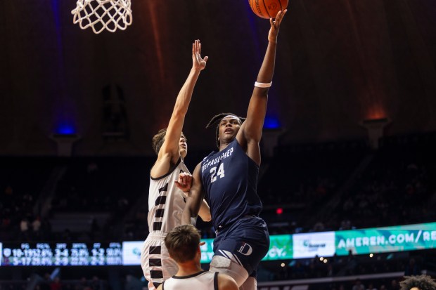 DePaul Prep's Rashaun Porter (24) goes to the basket against Mount Carmel during the Class 3A state championship game at State Farm Center in Champaign on Saturday, March 9, 2024. (Vincent D. Johnson/for the Daily Southtown)