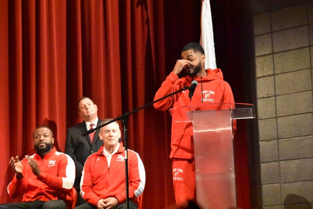 Basketball Coach Jamere Dismukes gets emotional during a speech following his team's first state championship. (Jesse Wright/Daily Southtown)