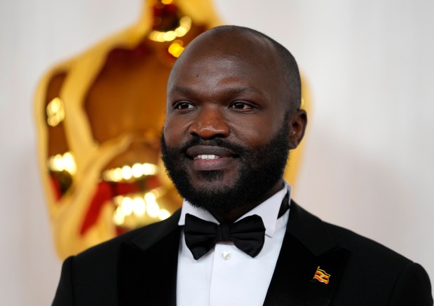 Moses Bwayo arrives at the Oscars on Sunday, March 10, 2024, at the Dolby Theatre in Los Angeles. (AP Photo/Ashley Landis)