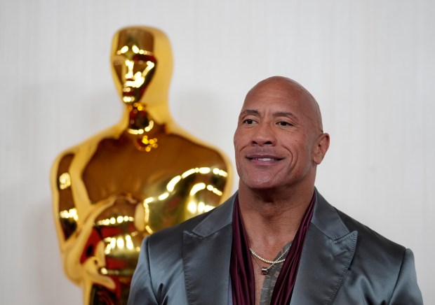 Dwayne Johnson arrives at the Oscars on Sunday, March 10, 2024, at the Dolby Theatre in Los Angeles. (AP Photo/Ashley Landis)