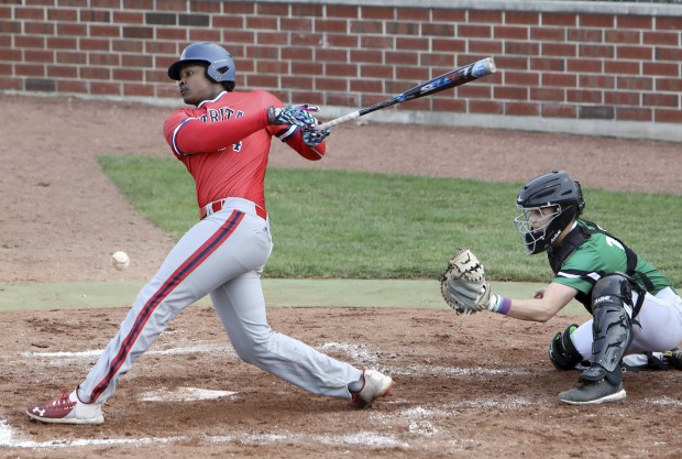 St Rita's Sir Jamison Jones connects against Providence during a Catholic League Blue game in New Lenox on Monday, April 11, 2022.