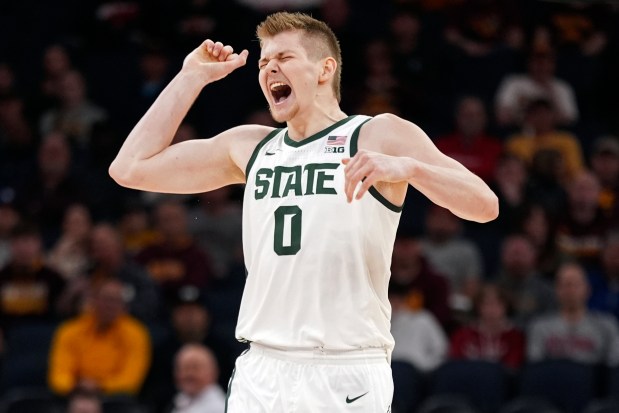 Michigan State forward Jaxon Kohler celebrates after a dunk by teammate Malik Hall during the first half against Minnesota in the second round of the Big Ten Tournament on Thursday, March 14, 2024, in Minneapolis. (Abbie Parr/AP)
