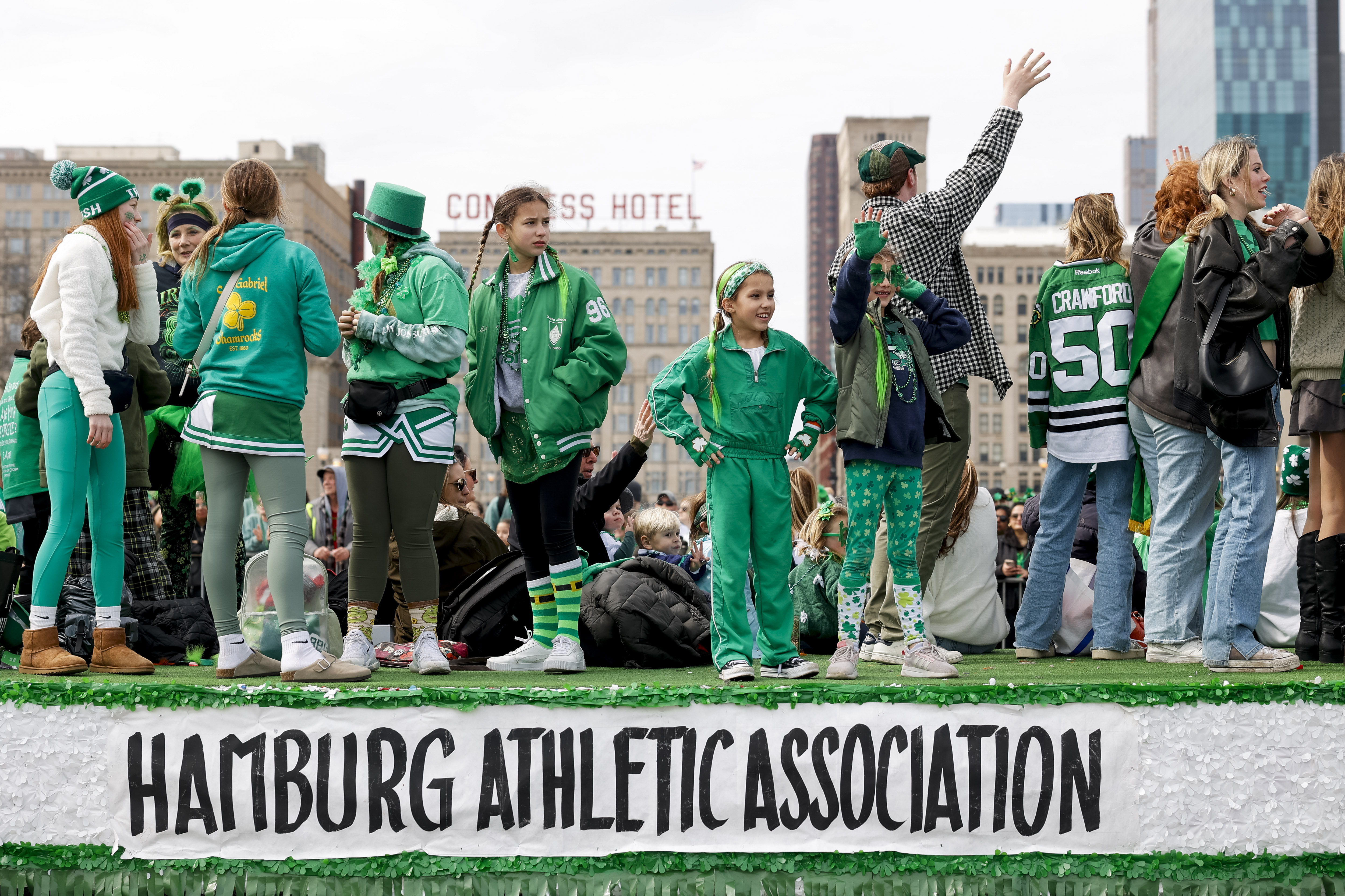 People on the Hamburg Athletic Association Float look to the crowd during the annual St. Patrick's Day Parade on Saturday, March 16, 2024, on Columbus Drive in Chicago. (Vincent Alban/Chicago Tribune)