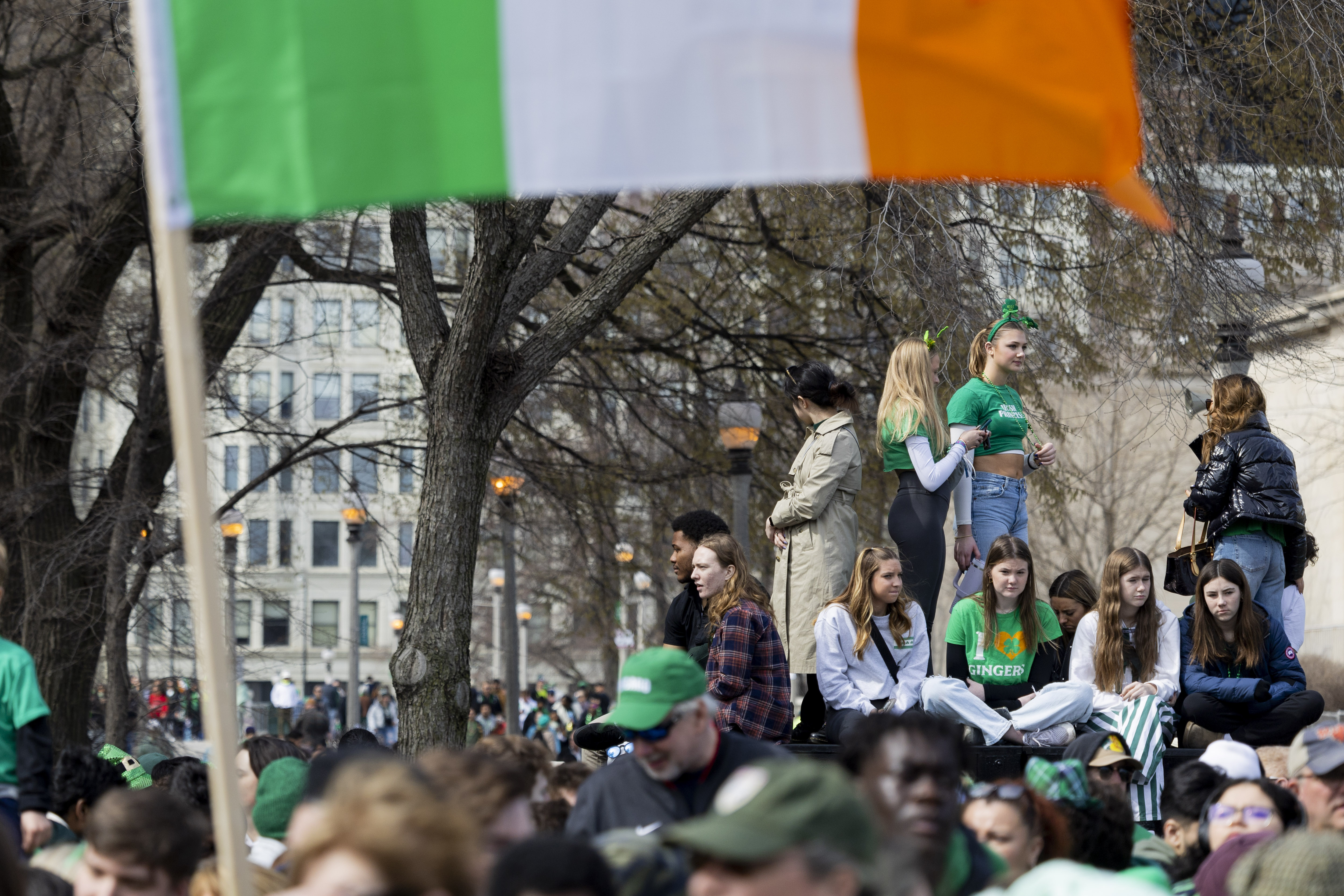 Spectators watch the annual St. Patrick's Day Parade, March 16, 2024, on Columbus Drive in Chicago. (Vincent Alban/Chicago Tribune)