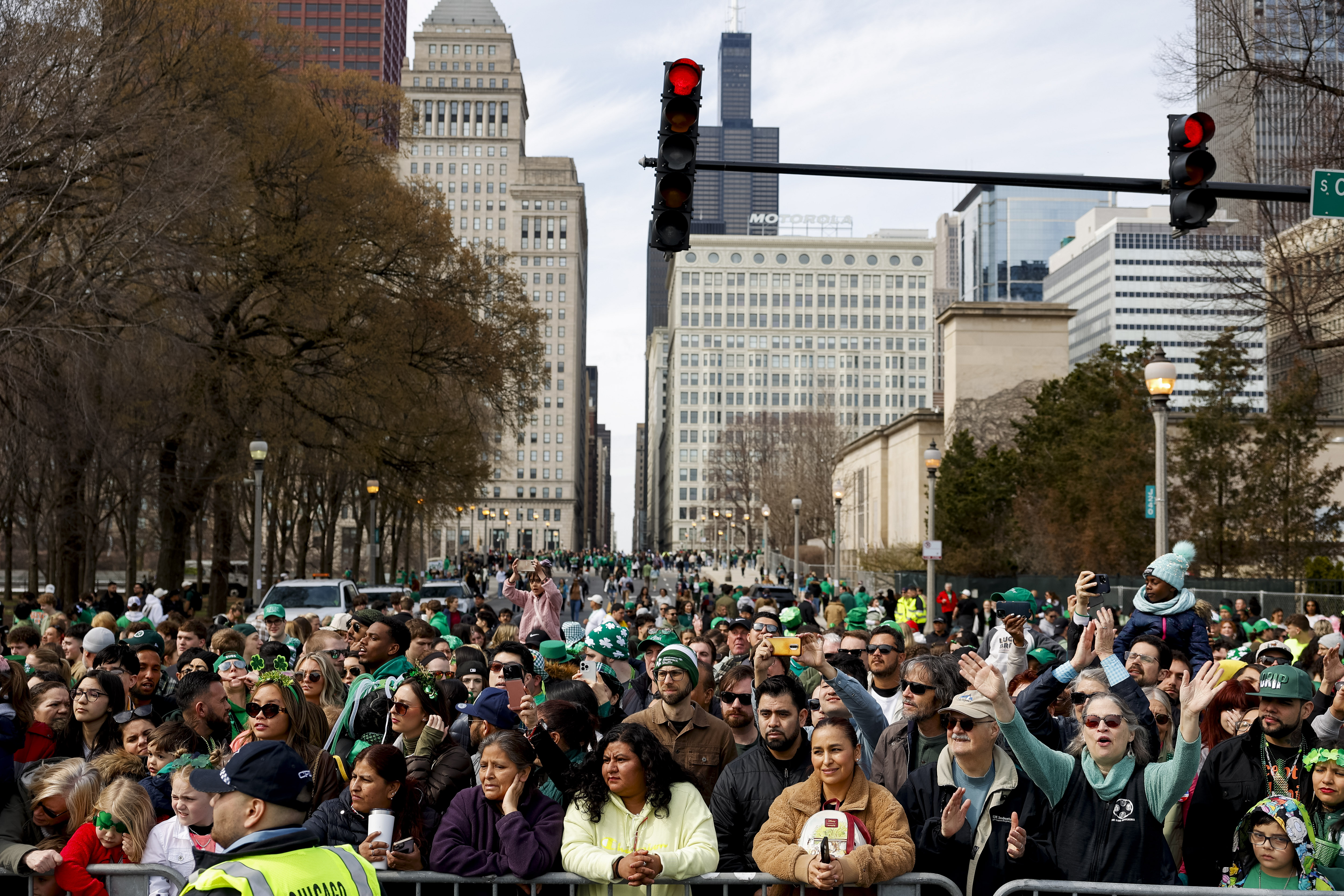 Spectators watch the annual St. Patrick's Day Parade, March 16, 2024, in downtown Chicago. (Vincent Alban/Chicago Tribune)