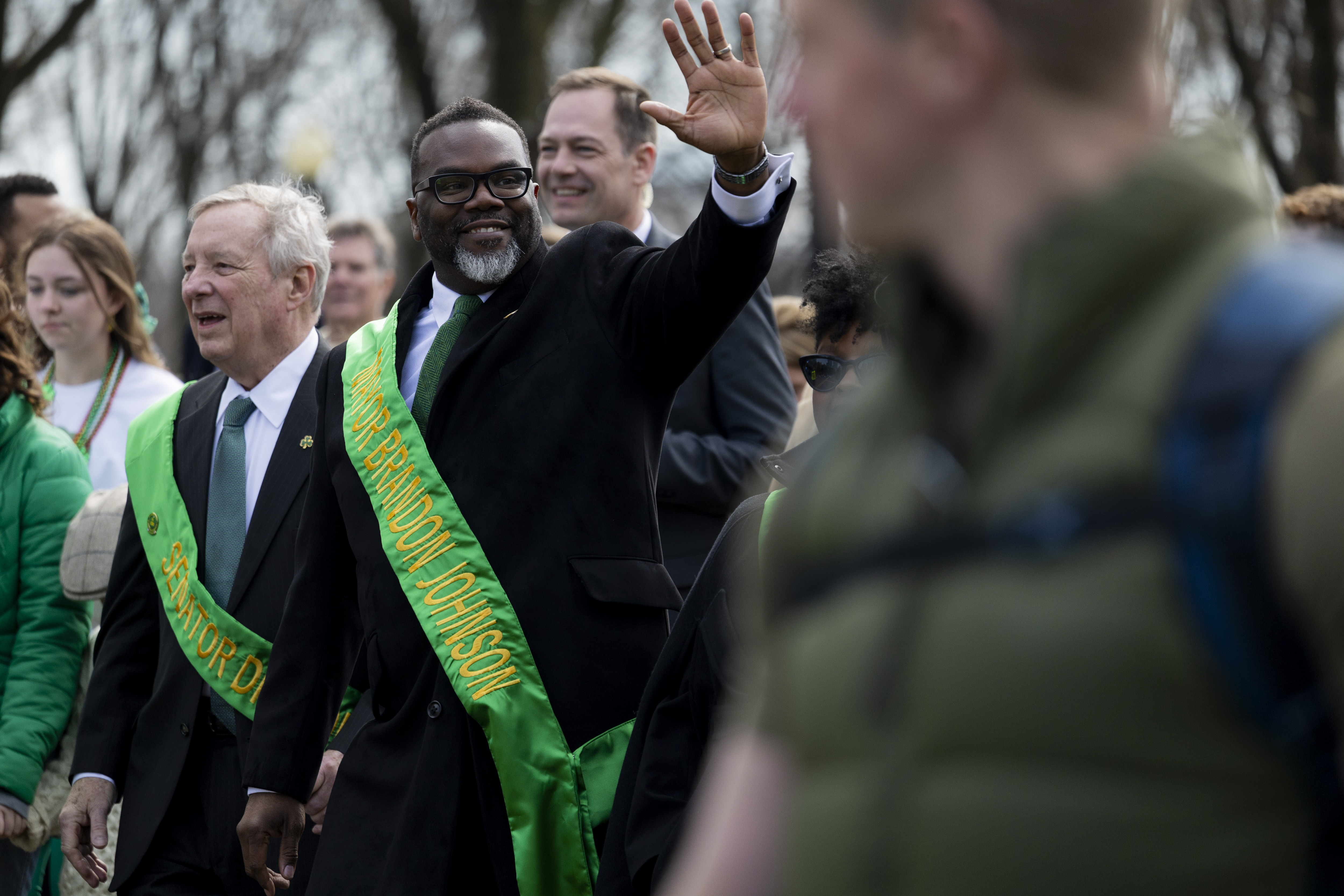 Sen. Dick Durbin and Chicago Mayor Brandon Johnson waves to the crowd during the annual St. Patrick's Day Parade on March 16, 2024, in downtown Chicago. (Vincent Alban/Chicago Tribune)