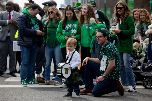 Joey Bognanno, center, 3, waits for the start of the annual St. Patrick's Day Parade on Saturday, March 16, 2024, in Chicago. (Vincent Alban/Chicago Tribune)