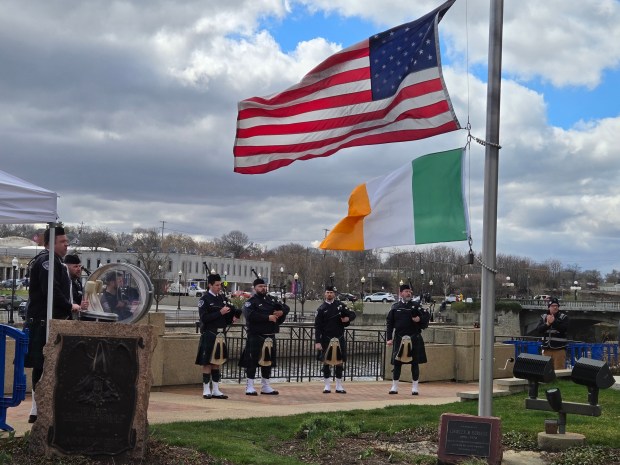 The Aurora Police Department Pipes and Drums band takes part in the St. Patrick's Day events in downtown Aurora on Sunday. (Gloria Casas / For The Beacon-News)
