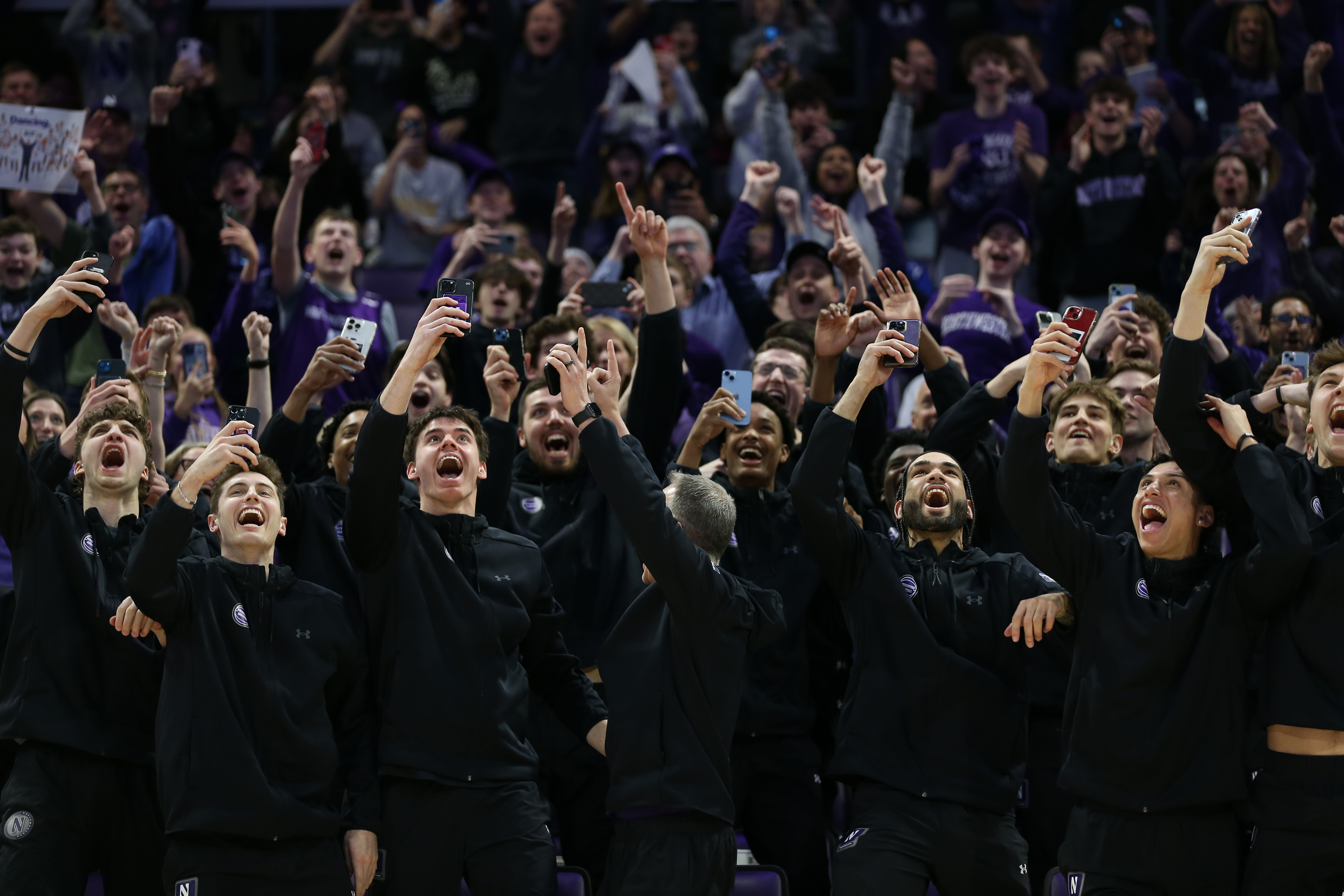 The Northwestern Men's basketball team celebrates during a NCAA selection show watch party at Welsh-Ryan Arena in Evanston on Sunday, March 17, 2024. The Northwestern Wildcats will face Florida Atlantic University in the first round of the NCAA Tournament. (Trent Sprague/Chicago Tribune)