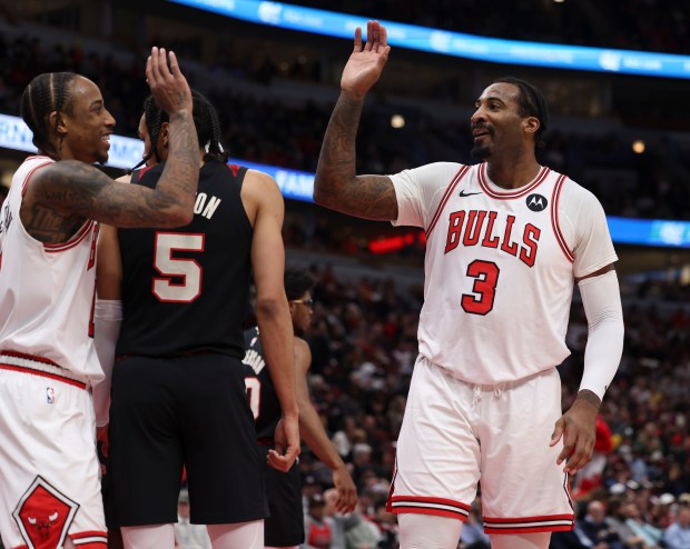 Chicago Bulls center Andre Drummond (3) celebrates a dunk with forward DeMar DeRozan (11) against the Portland Trail Blazers in the first half Monday, March 18, 2024, at the United Center. (Brian Cassella/Chicago Tribune)