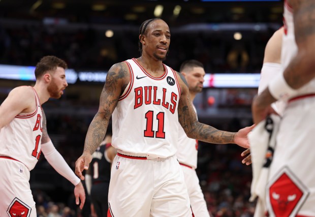 Chicago Bulls forward DeMar DeRozan (11) celebrates with teammates in the first half Monday, March 18, 2024, at the United Center. (Brian Cassella/Chicago Tribune)