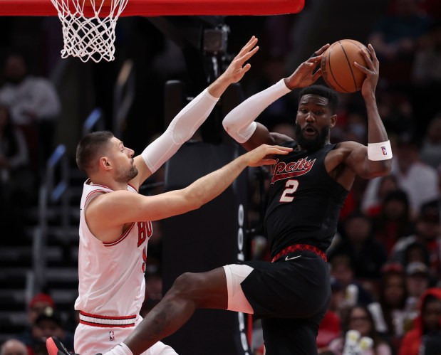 Chicago Bulls center Nikola Vucevic (9) defends Portland Trail Blazers center Deandre Ayton (2) in the first half Monday, March 18, 2024, at the United Center. (Brian Cassella/Chicago Tribune)